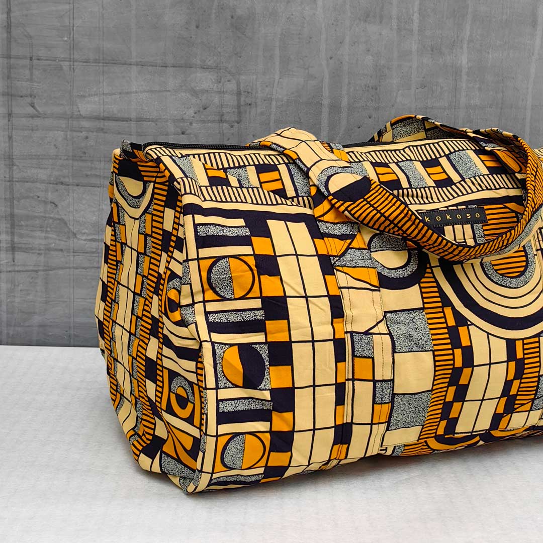sac de voyage en wax à motifs géométriques jaunes