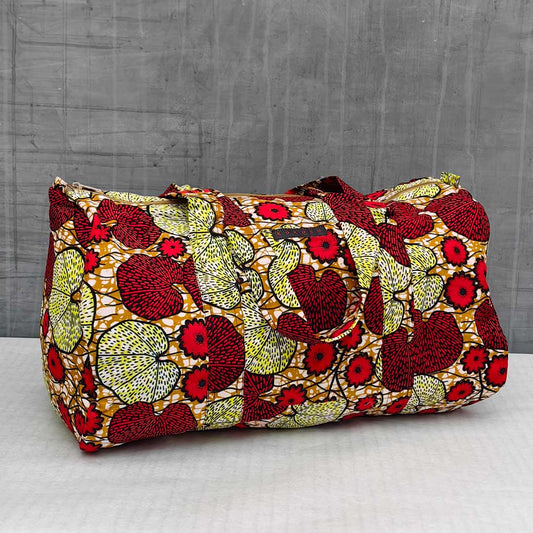 sac de voyage en wax à motifs floraux rouges