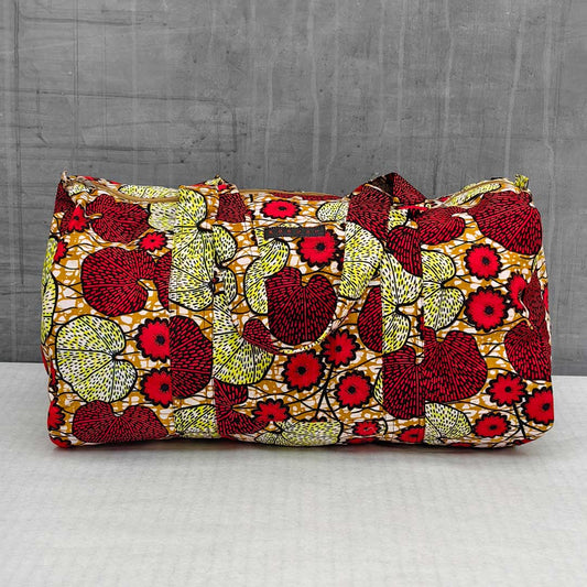 sac de voyage en wax à motifs floraux rouges