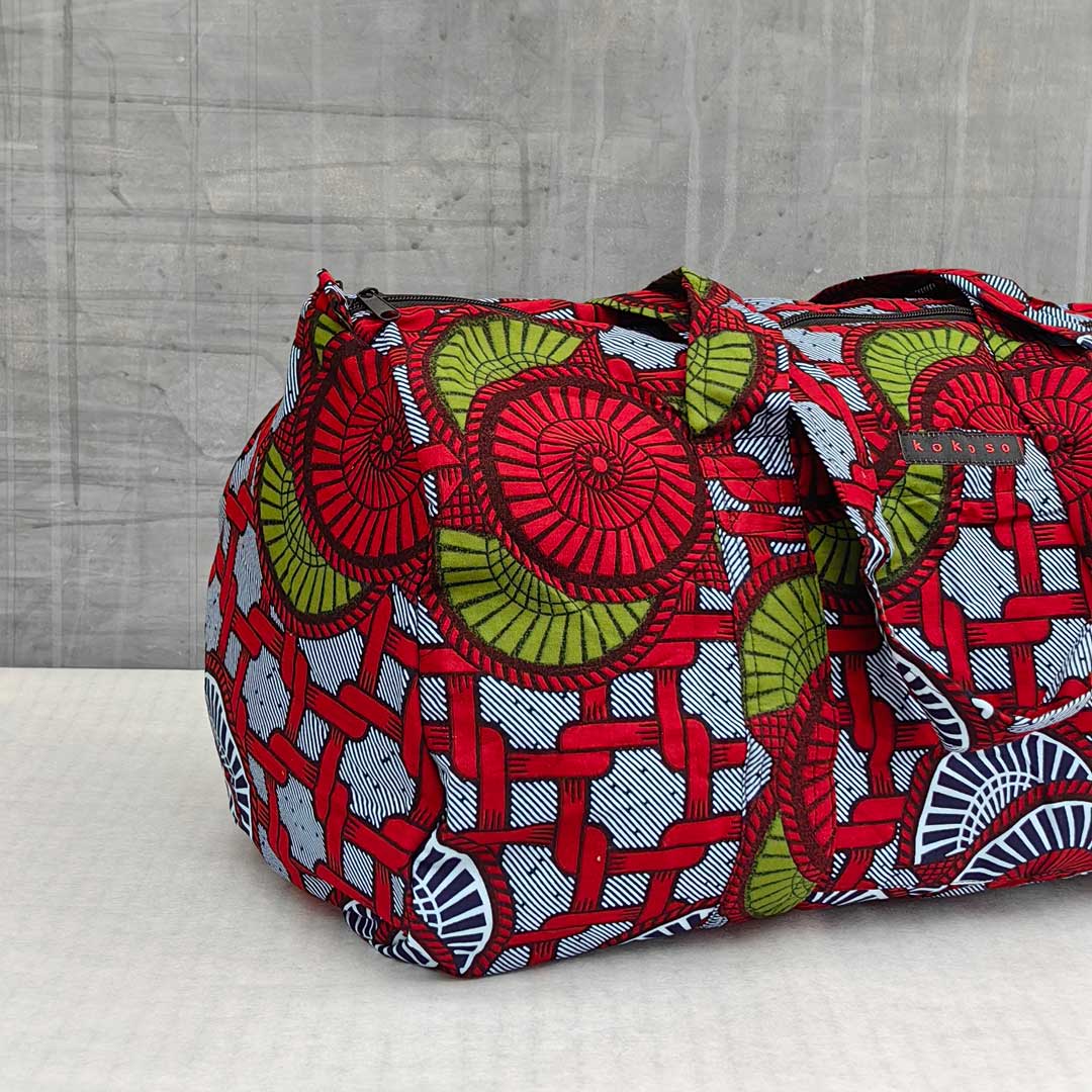 sac de voyage en wax à motifs rouges