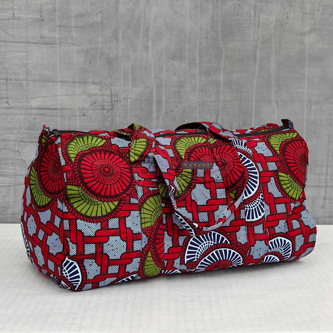 sac de voyage en wax à motifs rouges